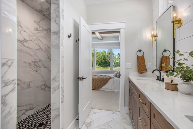 bathroom with vanity and tiled shower