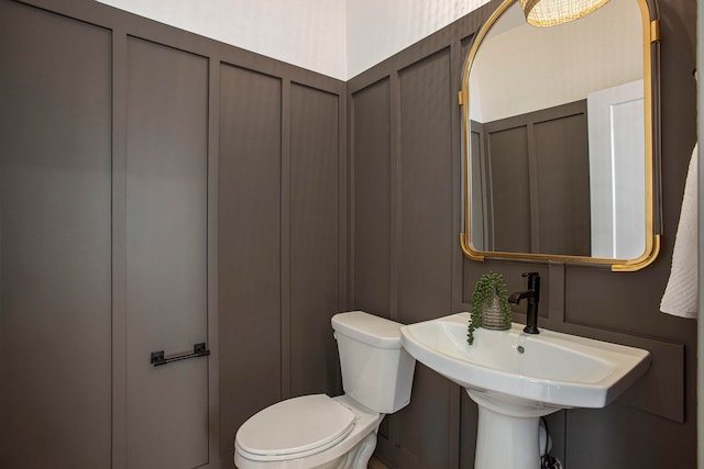 bathroom with toilet and sink