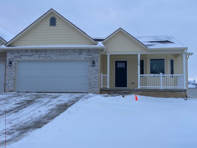 view of front of property with a garage and covered porch