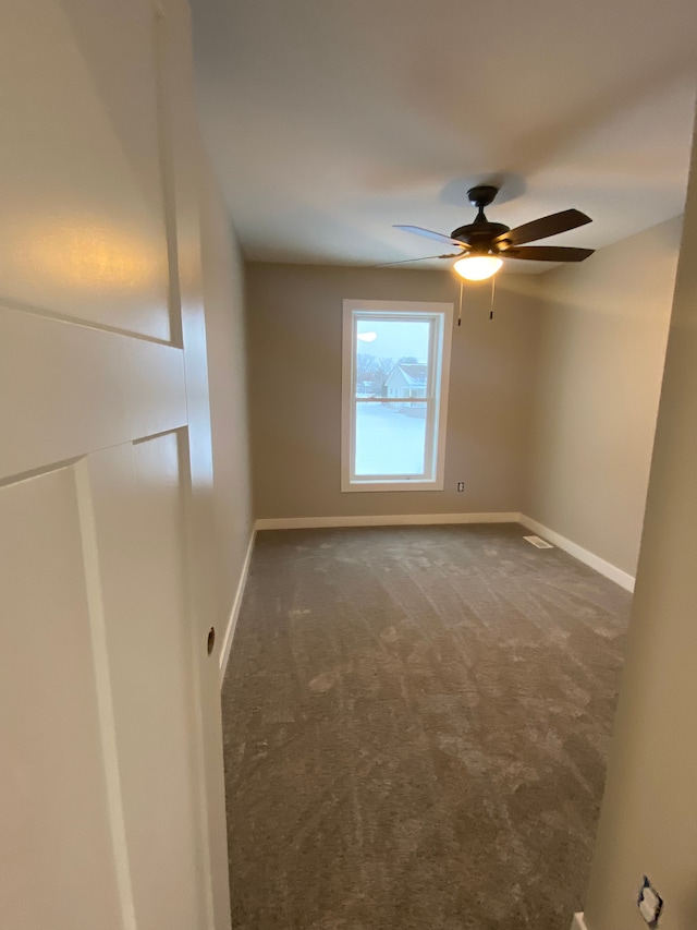 1430 N Mallard Cir, Owosso, MI 48867 - carpeted empty room with baseboards and a ceiling fan