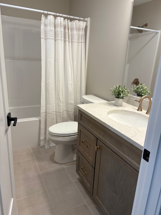 1430 N Mallard Cir, Owosso, MI 48867 - bathroom with toilet, vanity, shower / bath combo with shower curtain, and tile patterned floors
