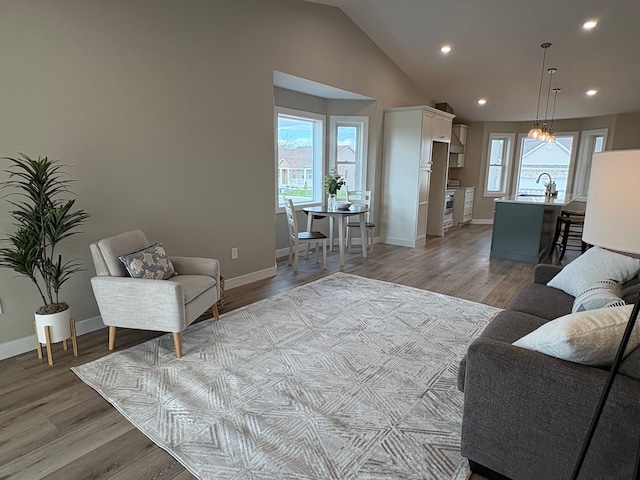 1430 N Mallard Cir, Owosso, MI 48867 - living room with recessed lighting, baseboards, plenty of natural light, and light wood-style floors