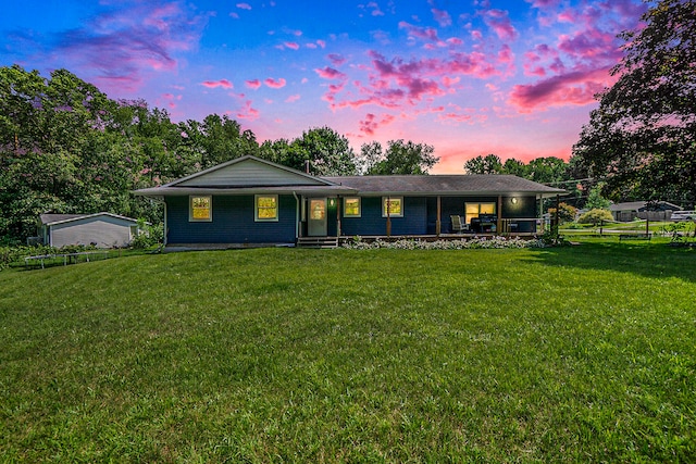 single story home featuring a yard