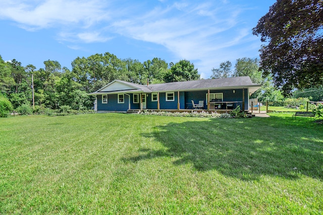 ranch-style home with a front lawn and a porch