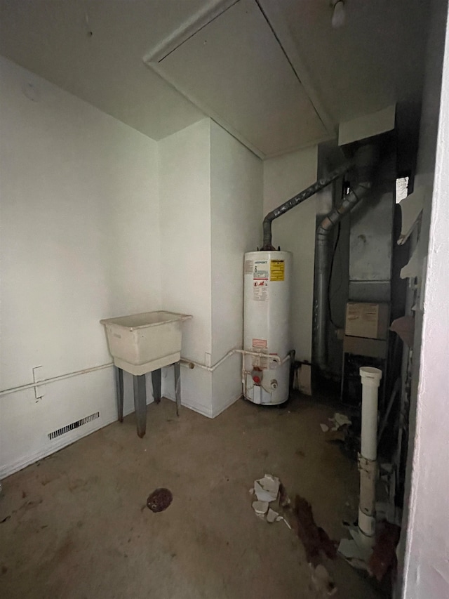 utility room with gas water heater