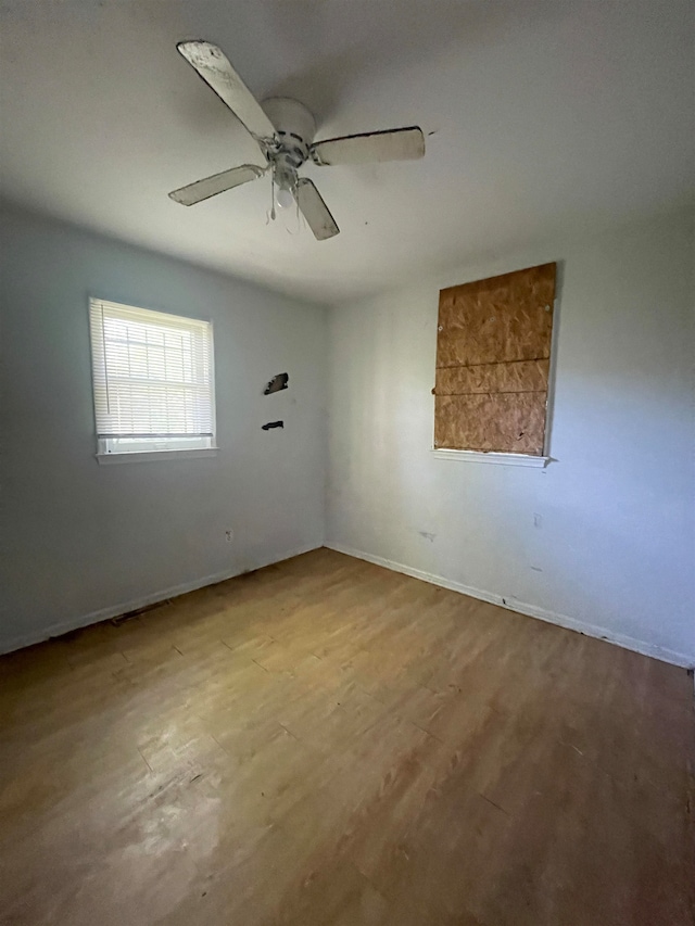 unfurnished room featuring ceiling fan and light hardwood / wood-style flooring