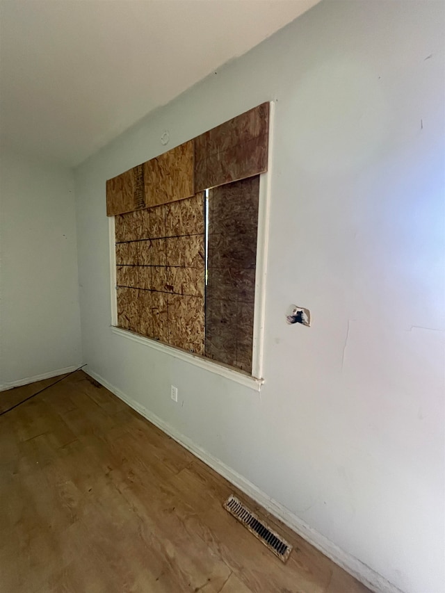 unfurnished room featuring hardwood / wood-style floors