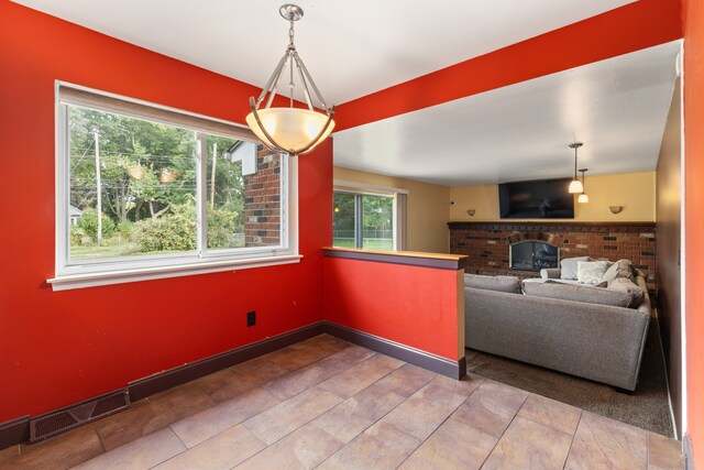 18230 Rainbow Dr, Lathrup Village, MI 48076 - unfurnished living room with a fireplace and baseboards