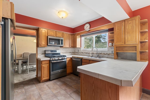 18230 Rainbow Dr, Lathrup Village, MI 48076 - kitchen with stainless steel appliances, open shelves, a peninsula, and light countertops