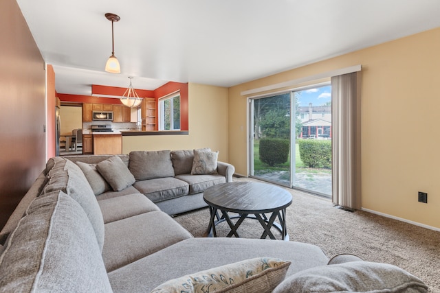 carpeted living room with plenty of natural light