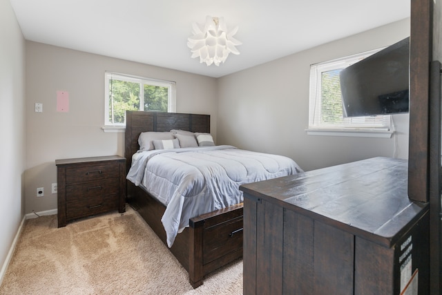 bedroom with light colored carpet