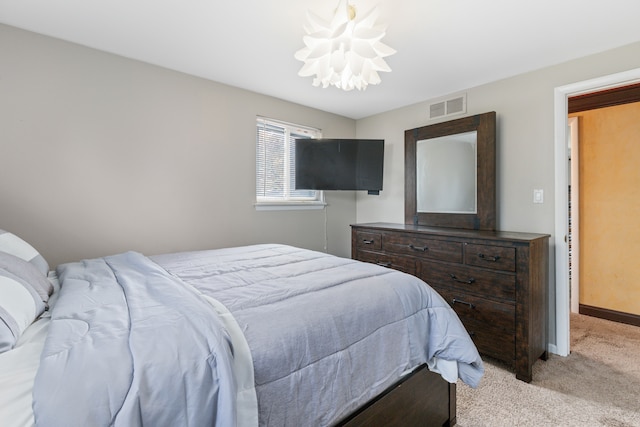 18230 Rainbow Dr, Lathrup Village, MI 48076 - bedroom with light colored carpet, a chandelier, and baseboards