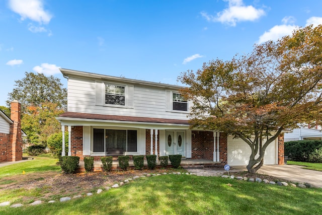 front of property featuring a porch, a garage, and a front lawn