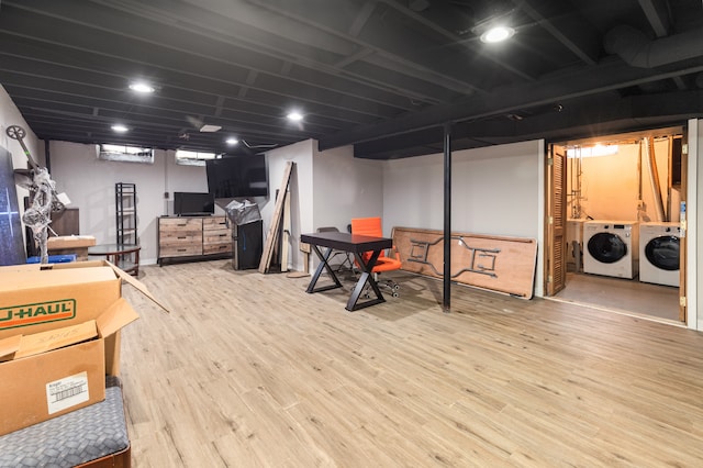 basement featuring hardwood / wood-style flooring and washing machine and clothes dryer