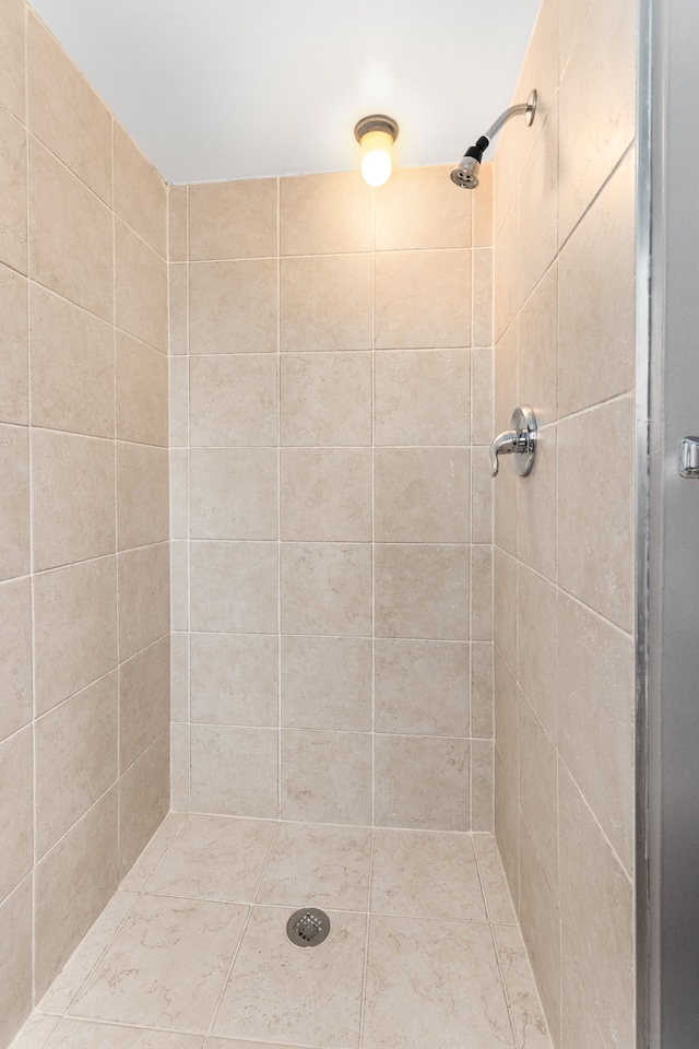 bathroom with a tile shower