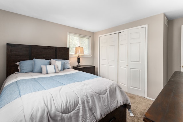 carpeted bedroom with a closet