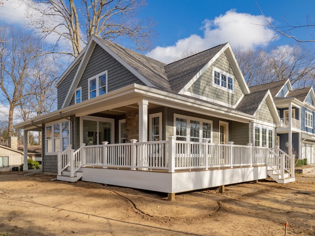 farmhouse-style home featuring a porch