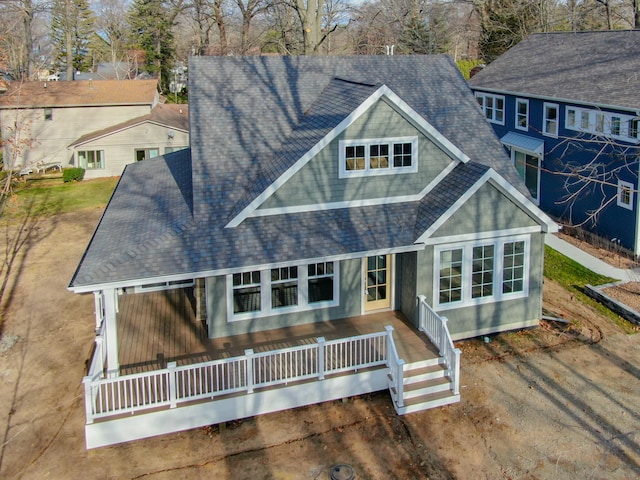 back of house featuring covered porch