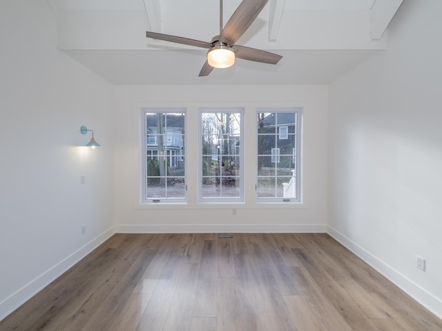 empty room featuring light hardwood / wood-style flooring, plenty of natural light, and ceiling fan