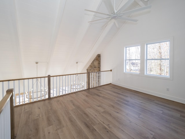 additional living space featuring beamed ceiling, dark hardwood / wood-style floors, high vaulted ceiling, and ceiling fan