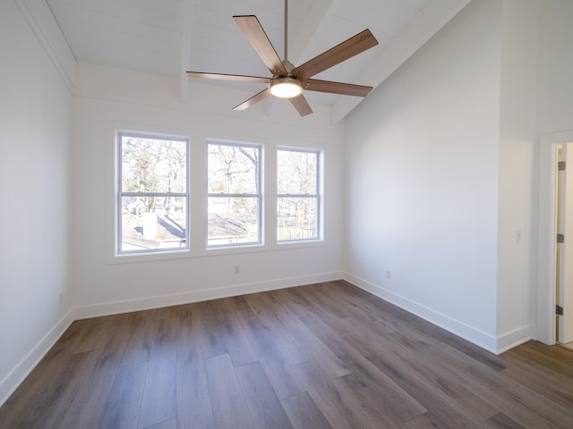 spare room featuring lofted ceiling with beams, hardwood / wood-style flooring, and ceiling fan