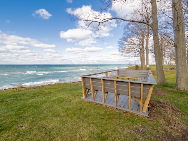 exterior space with a yard and a water view