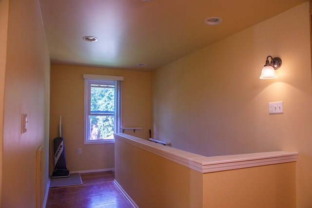 hall with dark wood-type flooring