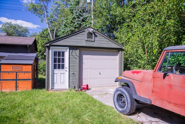 garage with a lawn