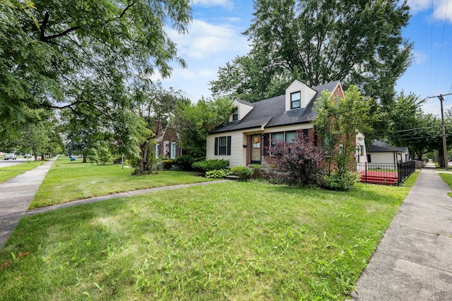 cape cod-style house with a front yard