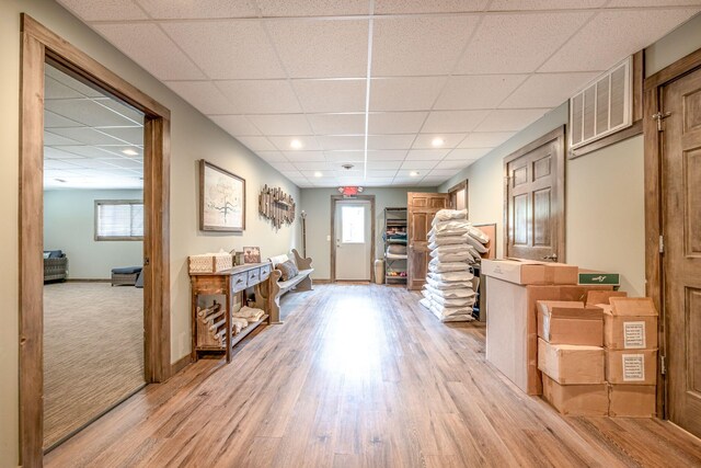 18564 200th, Tustin, MI 49688 - entrance foyer with light wood-style floors, healthy amount of natural light, a paneled ceiling, and baseboards