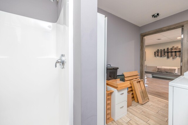 18564 200th, Tustin, MI 49688 - bathroom with wood finished floors and washer / clothes dryer
