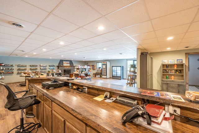 18564 200th, Tustin, MI 49688 - bar area featuring light wood-style floors and a paneled ceiling