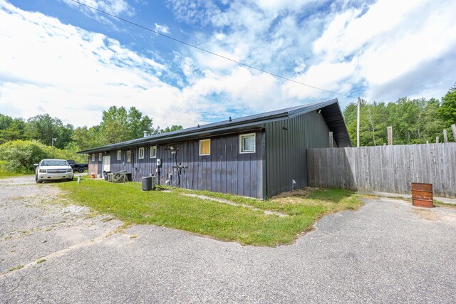 18564 200th, Tustin, MI 49688 - view of front of property with central AC and board and batten siding