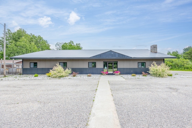 18564 200th, Tustin, MI 49688 - view of front facade with metal roof and a chimney