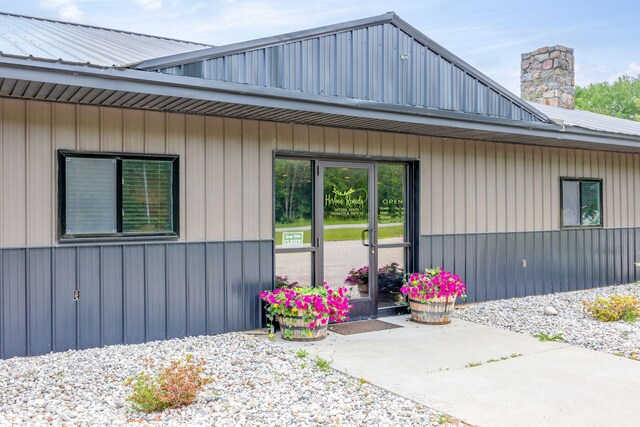 18564 200th, Tustin, MI 49688 - doorway to property with metal roof and a chimney