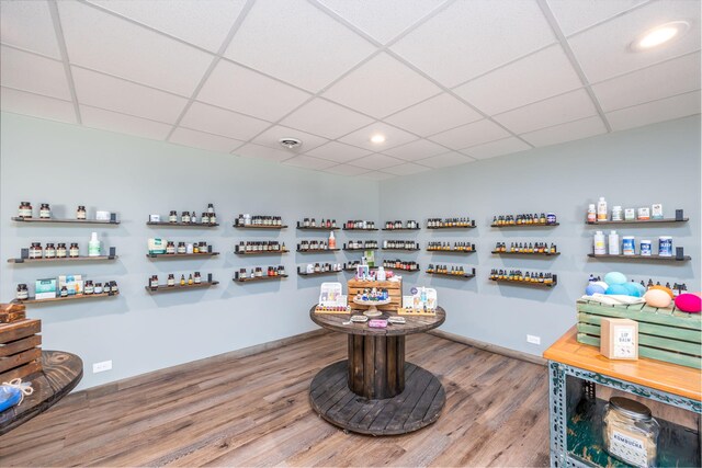 18564 200th, Tustin, MI 49688 - interior space with wood finished floors, a drop ceiling, recessed lighting, and baseboards