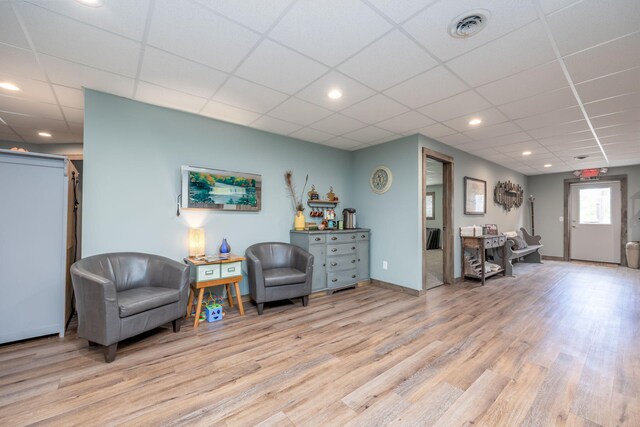 18564 200th, Tustin, MI 49688 - sitting room featuring light wood finished floors, a drop ceiling, recessed lighting, and baseboards