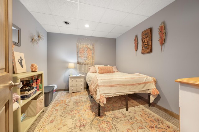 18564 200th, Tustin, MI 49688 - bedroom featuring a paneled ceiling and baseboards