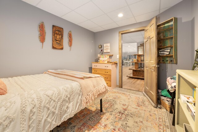 18564 200th, Tustin, MI 49688 - bedroom featuring a drop ceiling, wood finished floors, and recessed lighting
