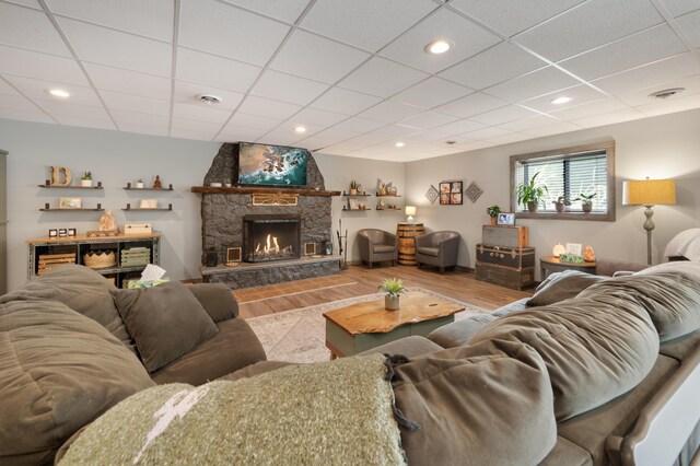 18564 200th, Tustin, MI 49688 - living room with wood finished floors, a fireplace, a drop ceiling, and recessed lighting