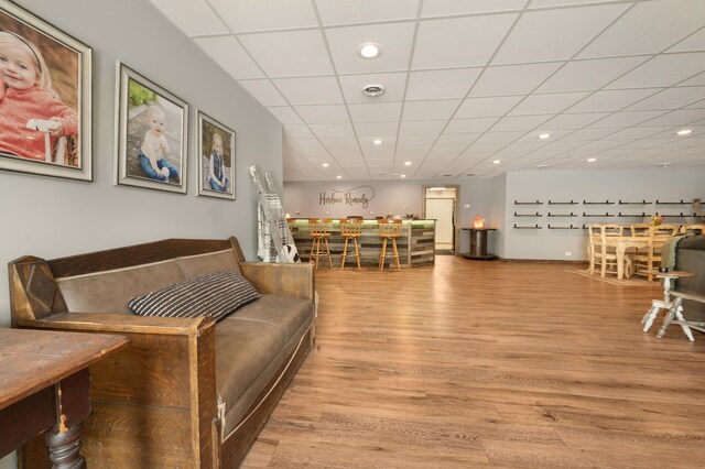 18564 200th, Tustin, MI 49688 - living room with light wood finished floors, a paneled ceiling, recessed lighting, and a community bar