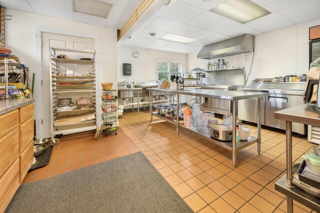18564 200th, Tustin, MI 49688 - kitchen with a drop ceiling, tile patterned flooring, and wall chimney range hood