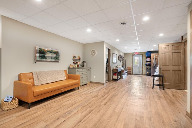 18564 200th, Tustin, MI 49688 - living room with light wood-style flooring, a paneled ceiling, recessed lighting, and baseboards