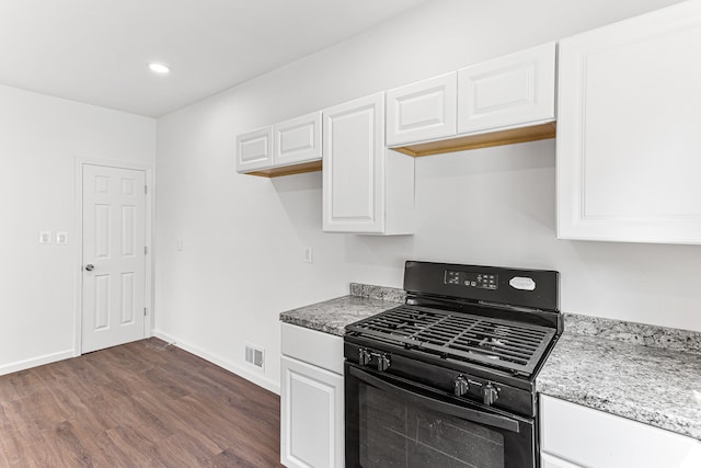 kitchen featuring light stone counters, black range with gas stovetop, white cabinetry, and dark wood-type flooring