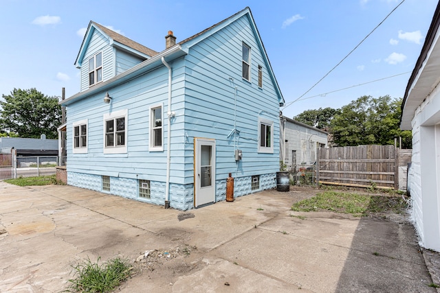 rear view of property featuring a patio area