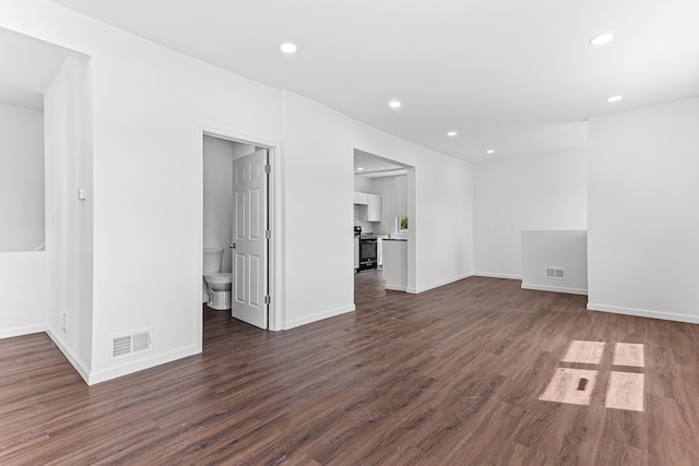 unfurnished room featuring dark hardwood / wood-style floors