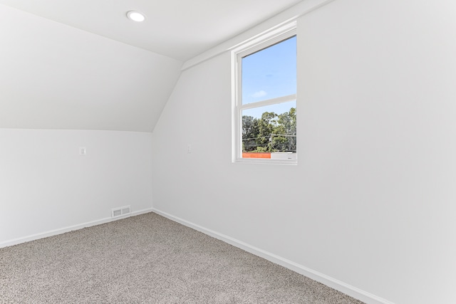 bonus room featuring carpet flooring and lofted ceiling