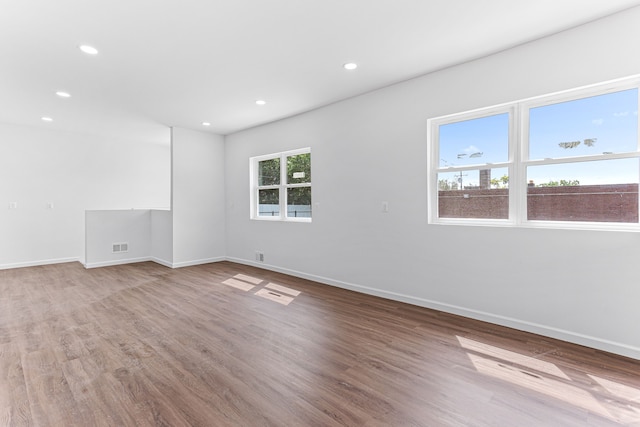 empty room with light hardwood / wood-style floors