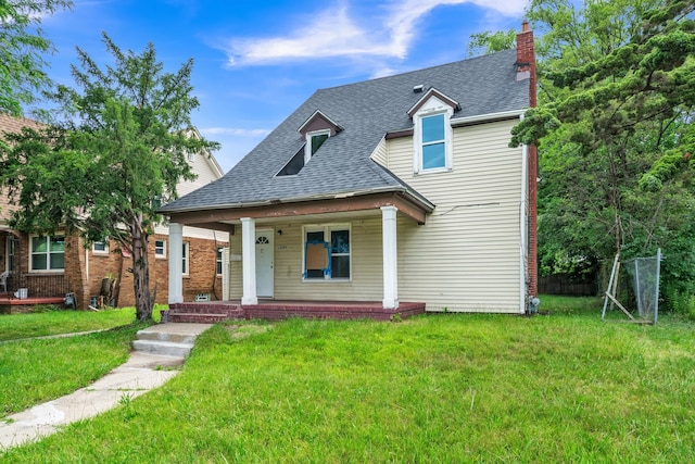 view of front facade with covered porch and a front lawn