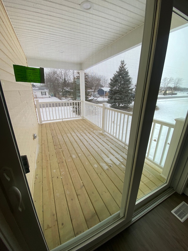 view of snow covered deck